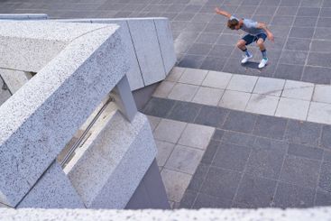 City, jump and man with skateboard, game and skills for...