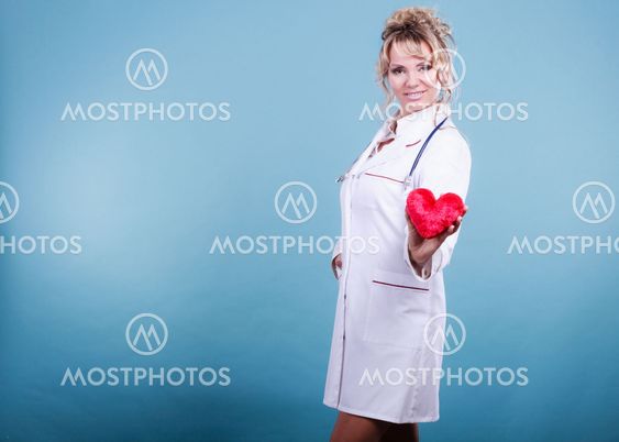 Middle aged blonde doctor enjoy her work.