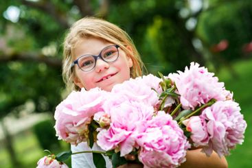 portrait of a happy cute little caucasian seven year old...