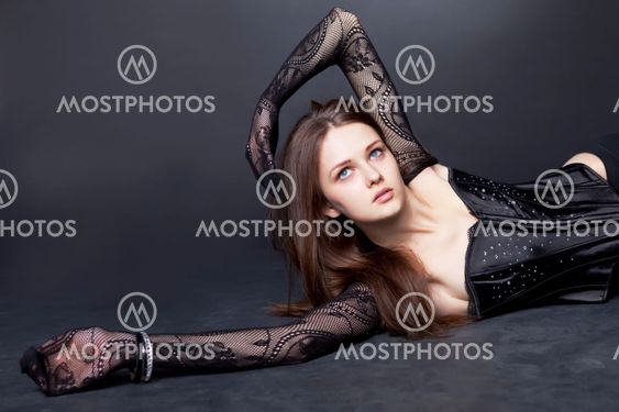 Beautiful girl with fishnet tights on hand