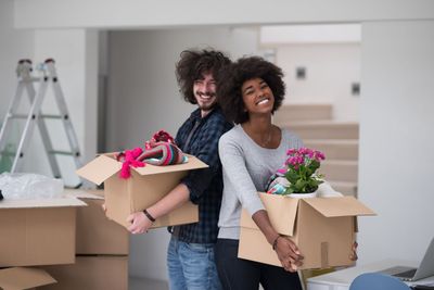 multiethnic couple moving into a new home