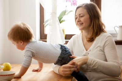 Mother with her beautiful baby boy at the kitchen