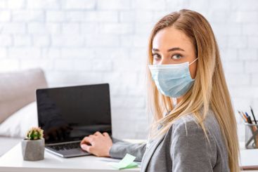 Quarantine concept. Woman at workplace at home