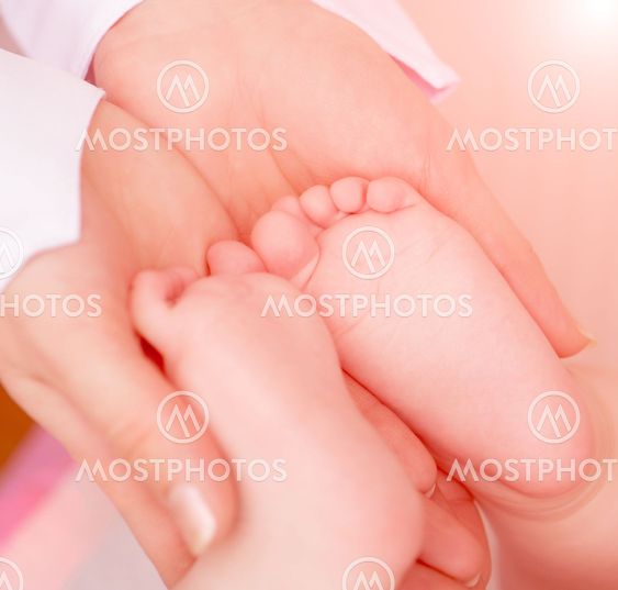 Doctor massaging baby