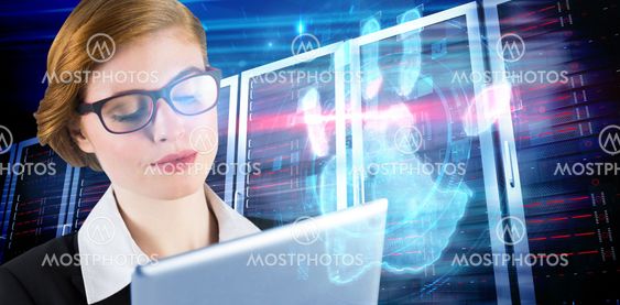 Composite image of redhead businesswoman using her tablet pc