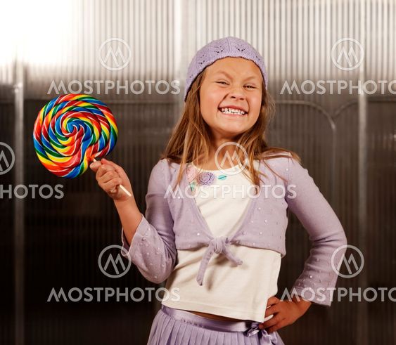 Cute young girl with lollipop