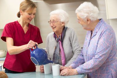 Senior women at home with carer