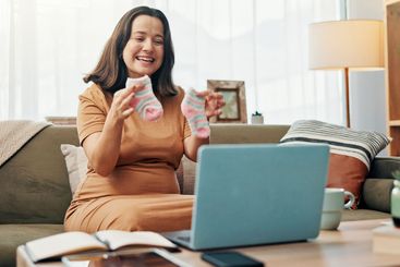 Pregnant, woman and baby clothes for video call, smile...