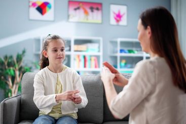 Child Learning Sign Language