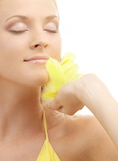 portrait of girl with yellow feathers