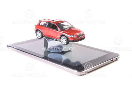 red toy car on tablet