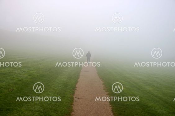 A man walking in to the mist