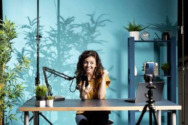 Woman filming video reacting to romantic text messages...