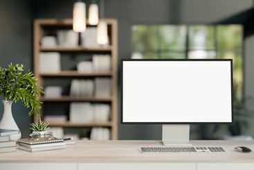 A computer desk in a modern office or home office...