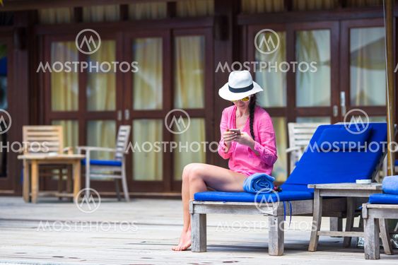 Young beautiful woman talking by phone