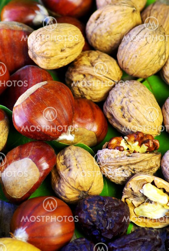 Assortment of nuts on wood background