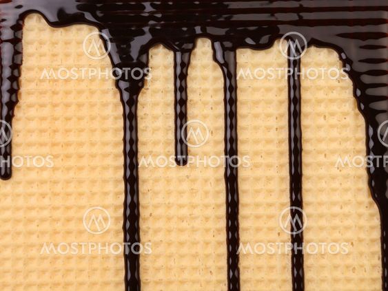 Background of wafer. Stream chocolate.