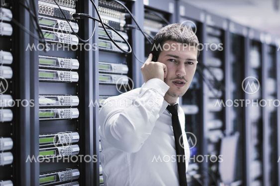 it engeneer talking by phone at network room