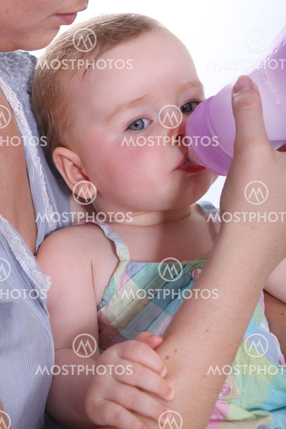 Baby drinking water from a bottle