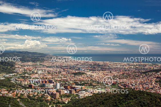 Barcelona city under cloudy sky overview