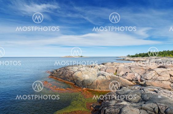 Rocky coastline in vivid colors during a beautiful summer...