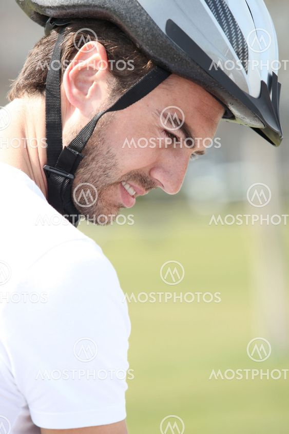 a man wearing a bike helmet
