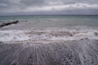 View of storm seascape. Dark moody sky over the gray...