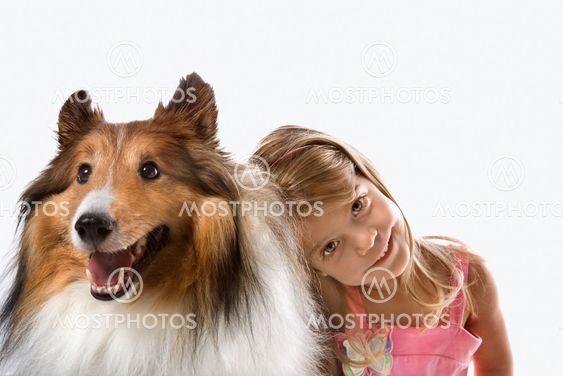 Girl child with Collie dog.