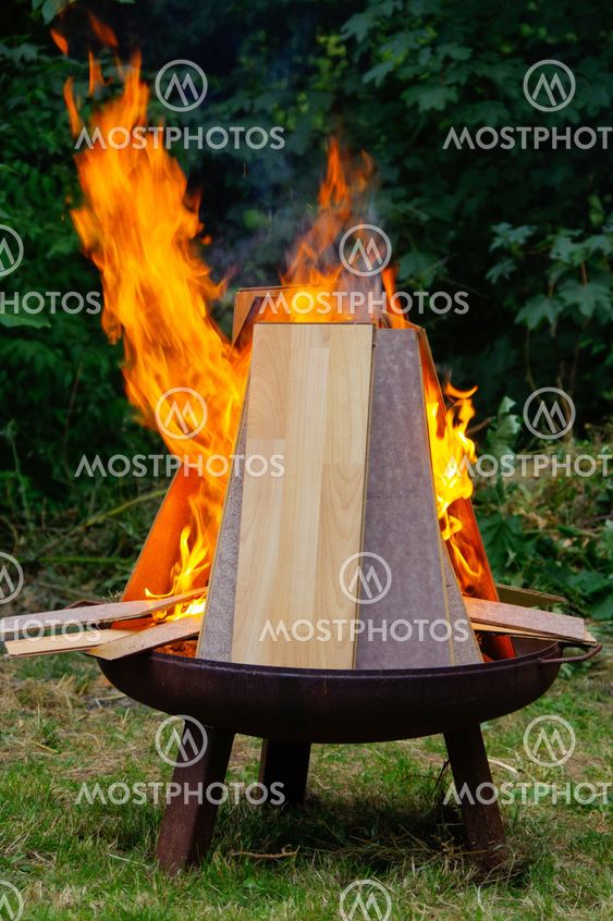 burning Laminate panels in open fire on a grill place