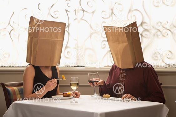 Couple wearing bags.