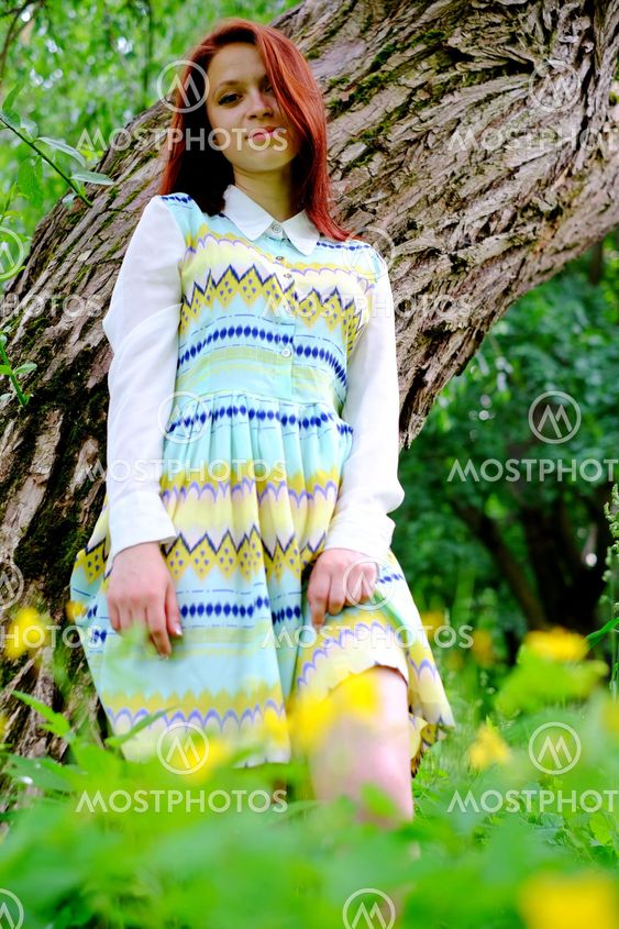 The girl near a tree