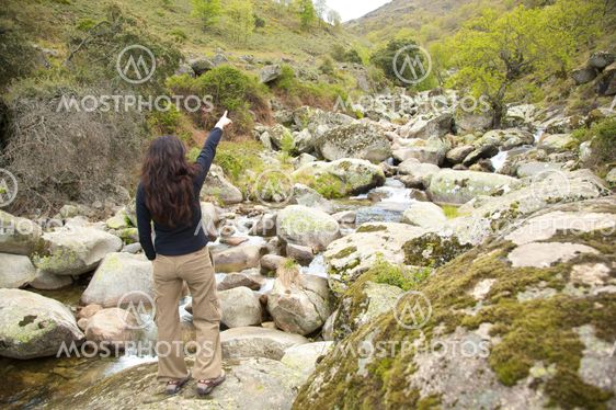 woman marking the origin of river