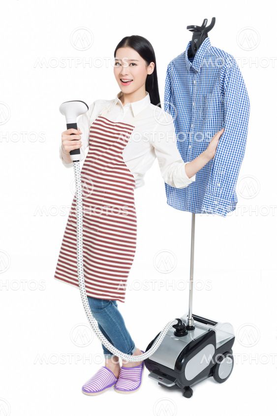 young housewife ironing