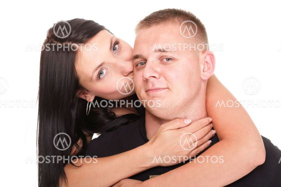 Portrait of a beautiful young happy smiling couple isolated
