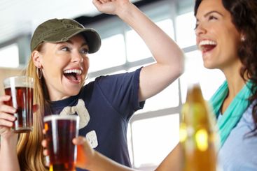 Celebration, beer and friends in pub with cheers, game...