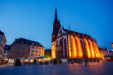 Marienkapelle with tall spire at summer dusk, Wurzburg,...