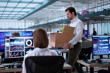 The African American employee is packing up his office