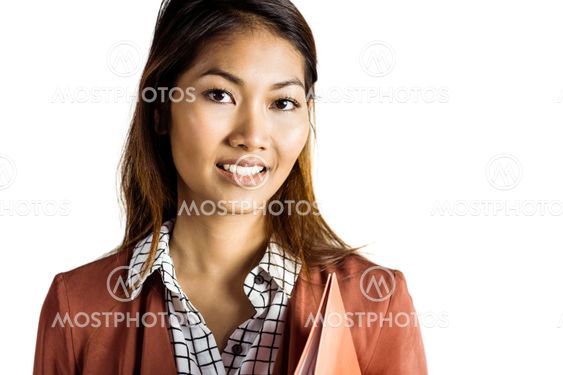 Smiling businesswoman holding a binder