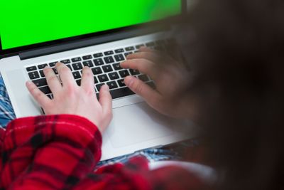 man freelancer in bathrobe working from home