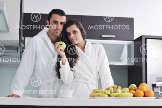 young couple have fun in modern kitchen