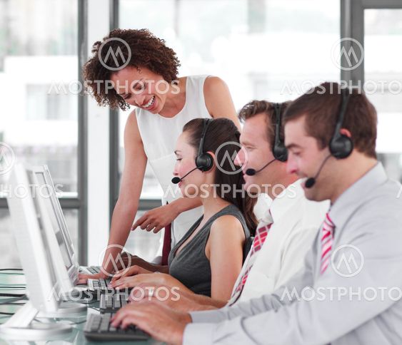 Confident female manager with her sale representative team