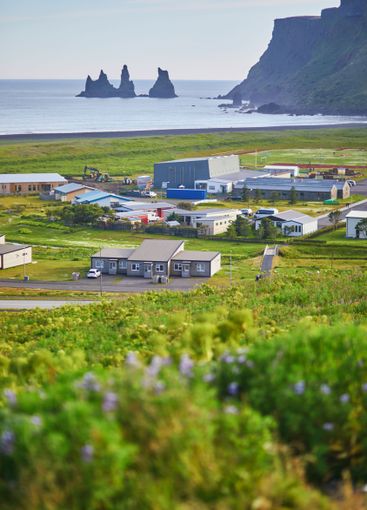 Scenic view of Vik village with ocean coast in Southern...