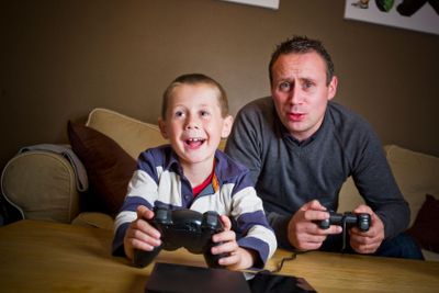 Father and son playing Video Games