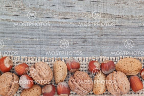 Christmas nuts on sackcloth. On the board texture.