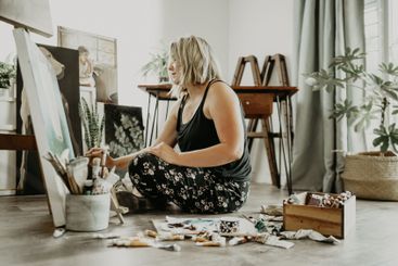 Art, woman and painting on paper or canvas in a home...