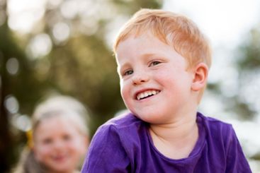 Smile, youth and fun with boy in park for adventure,...