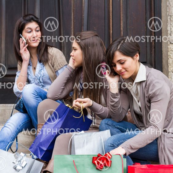 Group of Women Talking on Mobile Phone
