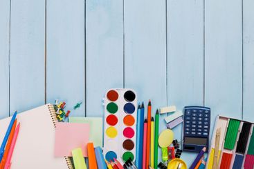 Brightly colored stationery and art supplies arranged on...