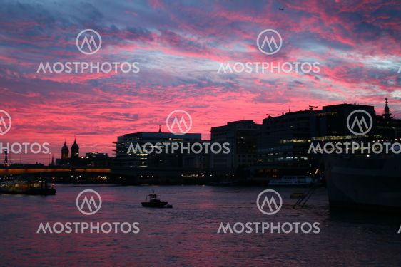 Night shot of London on the river Thames at sunset, the...