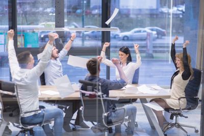 startup Group of young business people throwing documents